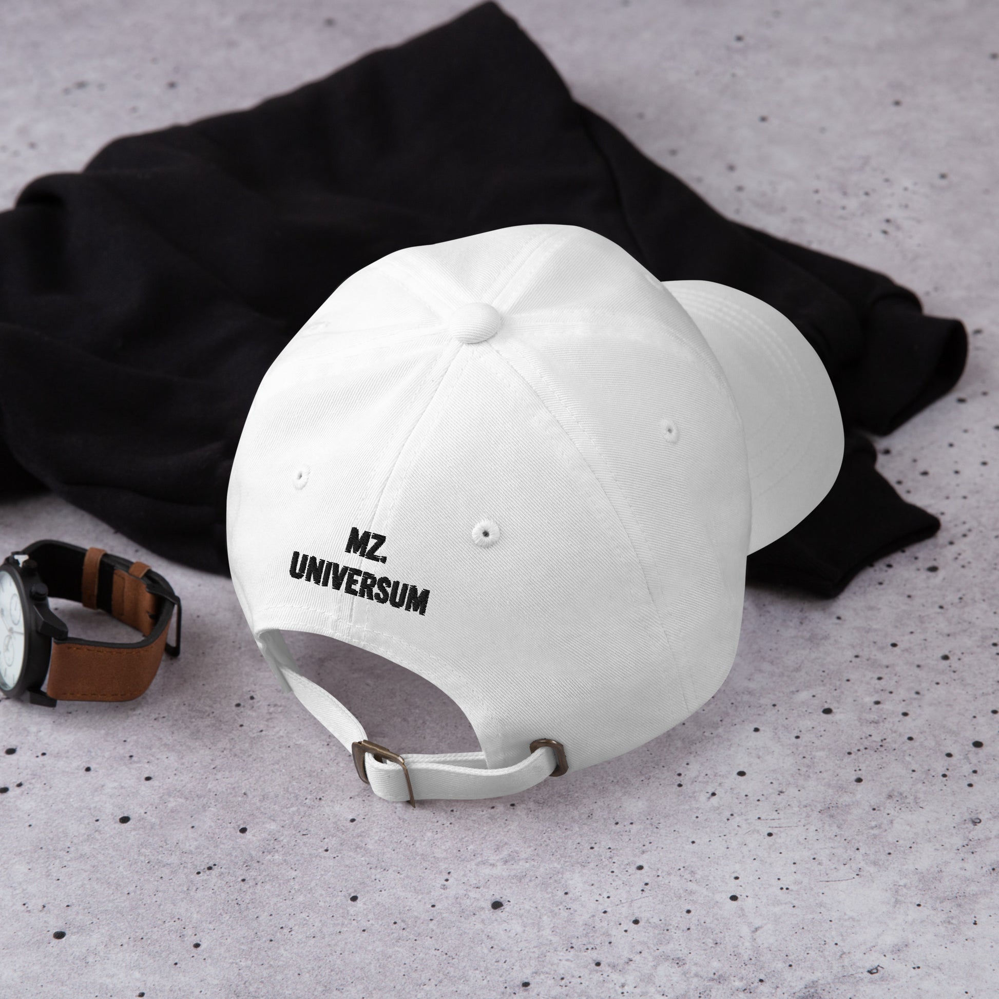 Lifestyle Image of the back of the white dad hat with MZ UNIVERSUM (brand name) embroidery