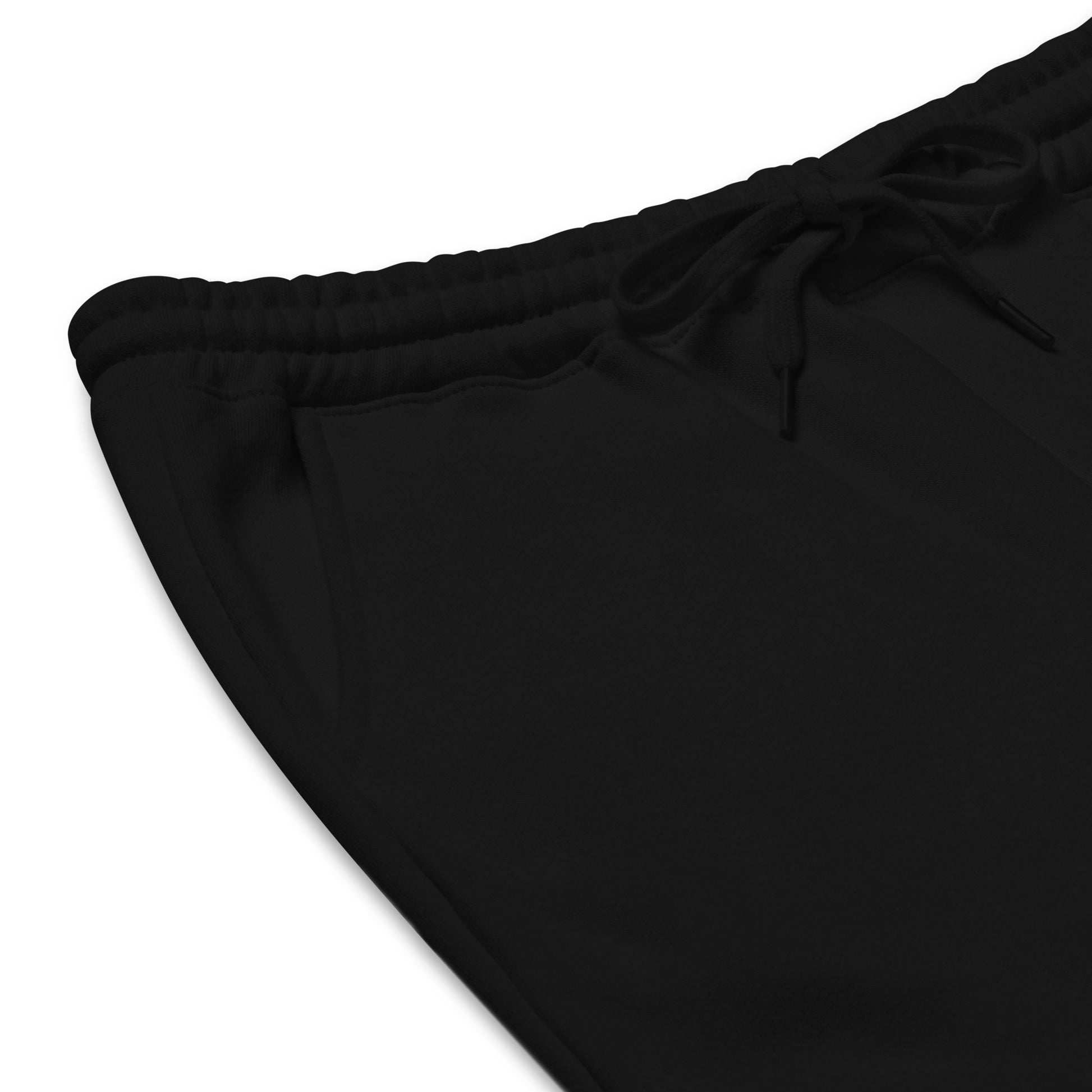 Close-up of the front waistband showing the elastic band and black shoestring drawcord tied in a bow.