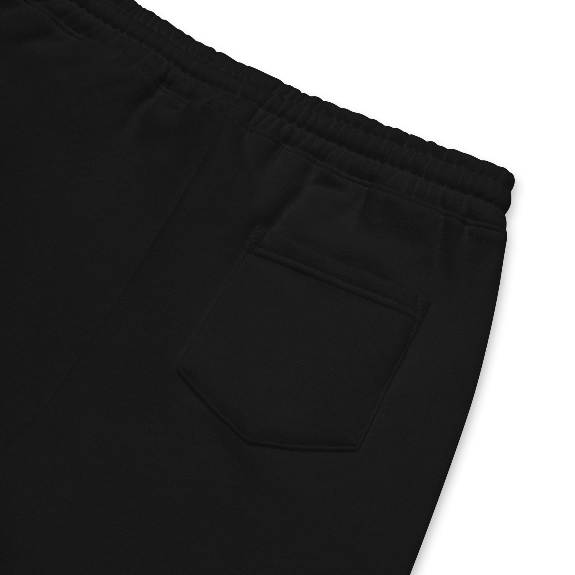 Close-up of the waistband and back pocket, showcasing stitching details and the soft fleece texture.